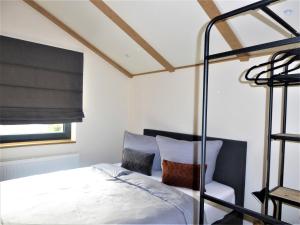 a bedroom with a bunk bed and a window at Chalet Diamond Winterberg 6 Person near by Bikepark Wifi in Winterberg