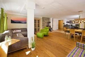 a living room with a couch and a table at Nagelfluh in Oberstaufen
