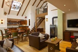 a living room filled with furniture and a fireplace at Hochgrat in Oberstaufen