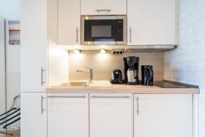 Kuchyň nebo kuchyňský kout v ubytování Ferienwohnung Meerblick App 805