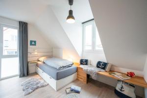 Postel nebo postele na pokoji v ubytování Willem und Konsorten - Ankerbucht