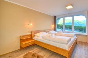 Posteľ alebo postele v izbe v ubytovaní Eichenhof Top 2 - by Alpen Apartments