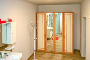 a bathroom with a shower and a door to a bathroom at Apartment Birke 3 - by Alpen Apartments in Bad Gastein