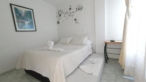 Postel nebo postele na pokoji v ubytování Hotel Miami en Melgar