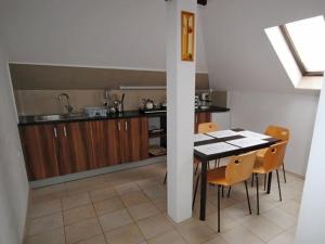 a kitchen with a table and chairs in a room at Villa in Brenna near Ski Lifts & Pool in Brenna