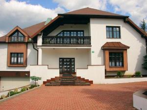 a large white house with a brick driveway at Villa in Brenna near Ski Lifts & Pool in Brenna