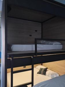 two bunk beds with their doors open on top at Casona Don Juan Hostel in San Gil