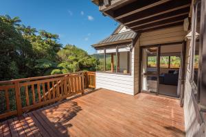 a large wooden deck on a house at Ridge Retreat in Rotorua