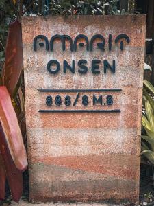 a sign for the entrance to the amazonoon sign at Amarit Onsen Homestay 