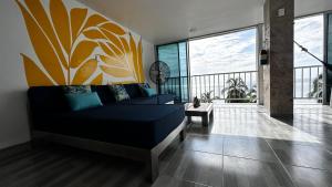 a living room with a couch and a large window at Vista increíble Chirama Rodadero in Santa Marta +31 photos