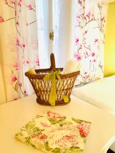 a basket on top of a table with a towel at Villa28 Self-Check- in in Aarau