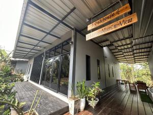 a porch of a house with a wooden deck at WildernessMountain View in Ban Thung Ta In