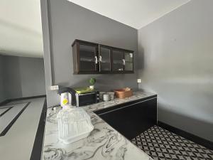 a kitchen with a counter top with a microwave at WildernessMountain View in Ban Thung Ta In
