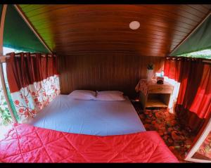 a bedroom with a bed in a tent at Aryans Keeth house farm stay in Idukki