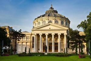 a large building with a dome on top of it at Athenee Calea Victoriei Apartment in Bucharest