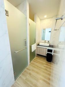 a bathroom with a sink and a shower and a mirror at 22 Twenty Two Chiang Mai in Chiang Mai +55 photos