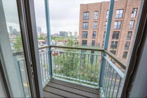 a balcony with a view of a building at NovaNest Salford Apartment in Manchester