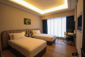 Sayarsan Hotel Yangon客房内的一张或多张床位