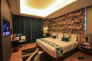 Sayarsan Hotel Yangon客房内的一张或多张床位