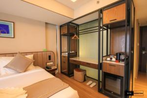 Sayarsan Hotel Yangon客房内的一张或多张床位