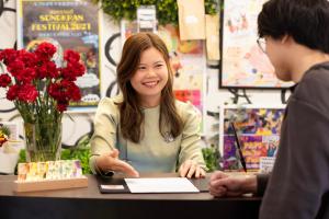 a woman sitting at a table talking to a man at パプリカホテルです in Kisarazu +50 photos