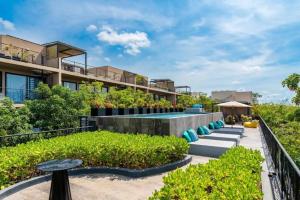a view of a building with a garden at Casa Serfin in Tulum