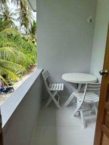 A balcony or terrace at Island Luxury Dive Hotel - Fulhadhoo