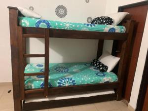 a couple of bunk beds in a room at Balcones de la Casona in Guatapé