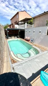 a swimming pool on top of a house at Maison luxe Little Bohême, Port Grimaud Saint Tropez in Grimaud