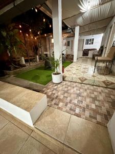 a patio with a plant in a pot on a building at Hostal Villa Marta in Santa Ana +19 photos