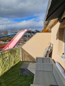 a view of a playground with a roller coaster at Laguna apartman Bogács in Bogács