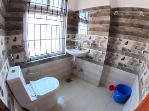Vannituba majutusasutuses Hotel Global Village