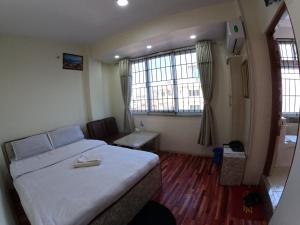 Voodi või voodid majutusasutuse Hotel Global Village toas