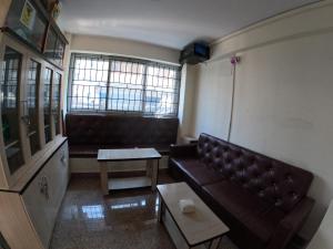 a living room with a couch and a table at Hotel Global Village in Kathmandu