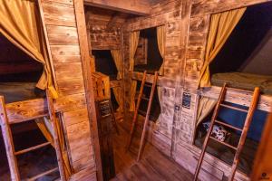 an inside view of a cabin with wooden walls at LE REFUGE DES TOUPINS in Prunières