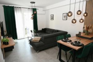 a living room with a couch and a table at ADRIANIK Apartment in Zagreb
