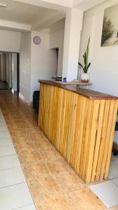 a wooden counter in a room with at Tamaro Beach Resort in Hikkaduwa