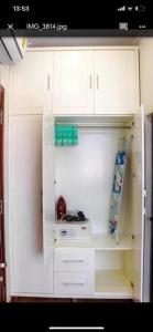 a white refrigerator with its door open in a kitchen at căn hộ Lý Chính Thắng in Ho Chi Minh City