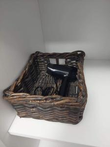 a wicker basket sitting on top of a shelf at ALDIRA Studio Arena Nationala in Bucharest