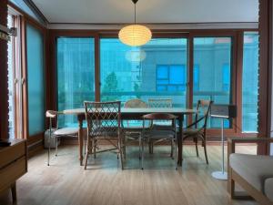 a dining room with a table and some chairs at Mapo Villa in Shinchon in Seoul