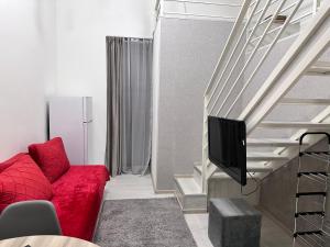 TV a/nebo společenská místnost v ubytování Mandarin Hotel