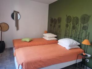 two beds sitting next to each other in a room at Côté Lac Tolla in Tolla +66 photos