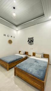 Кровать или кровати в номере Juliana HomeStay