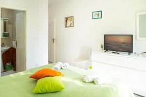 Postel nebo postele na pokoji v ubytování Villa Ruza