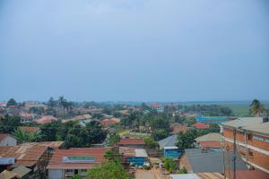 an aerial view of a small town with buildings at Transit Haven in Entebbe