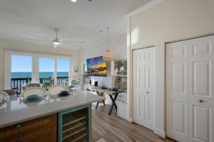 a kitchen with a view of the ocean at Sunset Sands at Capri in Bradenton Beach