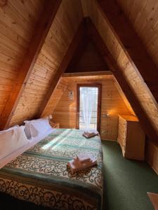 a bedroom with a bed in an attic at Chalet Natura Sport&Relax in Cavaliere