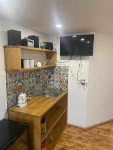 Kuchyň nebo kuchyňský kout v ubytování Apartmány MonTexas