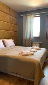 Voodi või voodid majutusasutuse Cozy Apartment B35 in Grand Resort Pamporovo toas