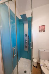 a bathroom with a shower and a toilet at Paraje del Hueznar in Cazalla de la Sierra